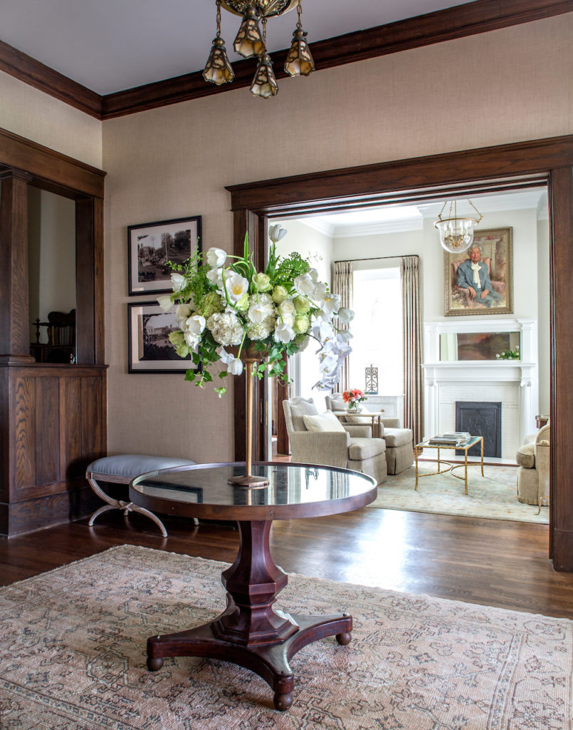 The Stratton House entry table and seasonal arrangement provides a welcoming focal point that seamlessly draws you into the surrounding rooms of the boutique B&B in Collierville.