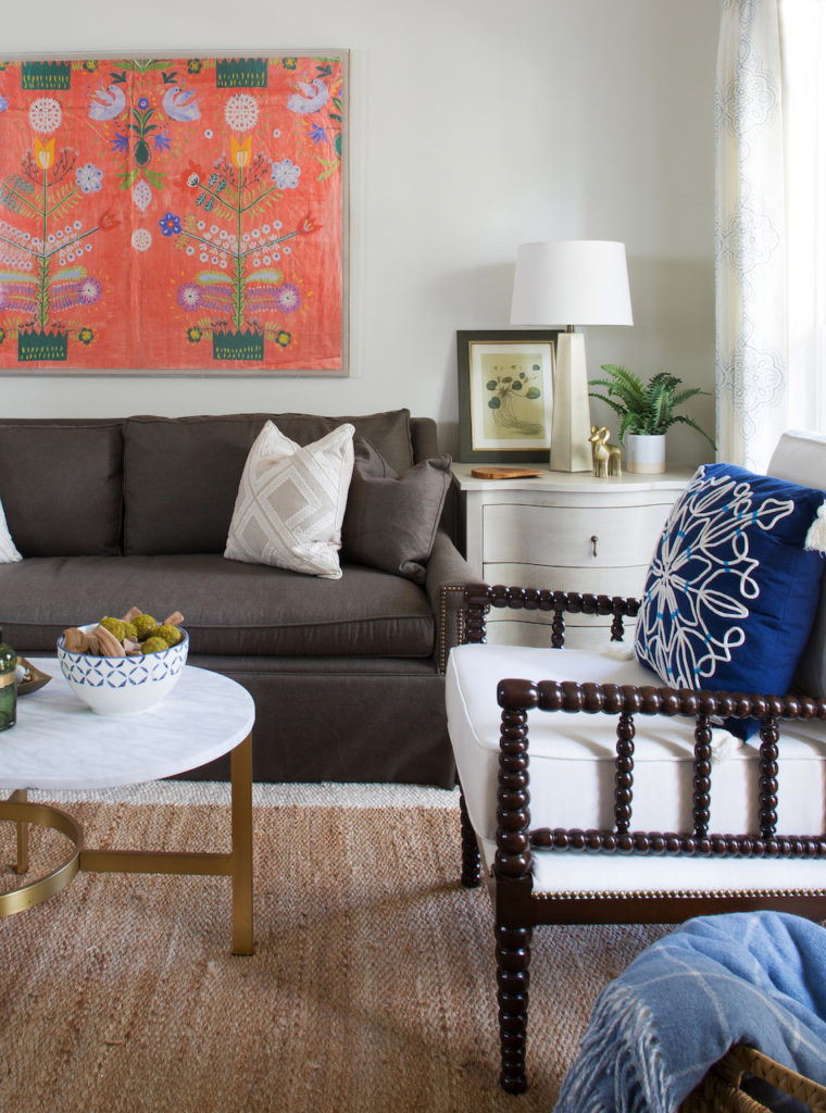It’s important to show a little leg, which offsets skirted furniture and helps keep an appealing rhythm in the room.